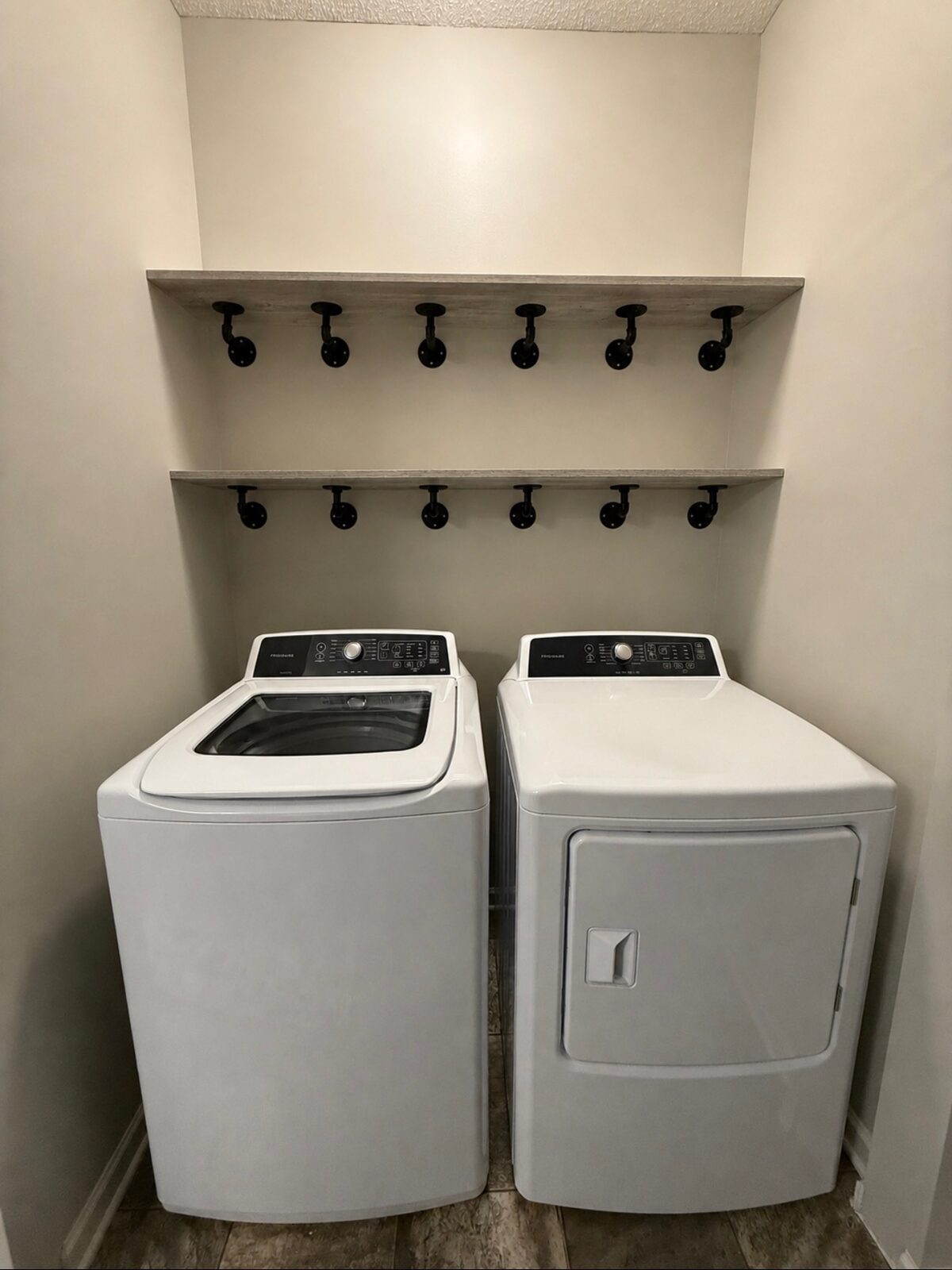 Laundry room with new full-width shelves installed above washer and dryer